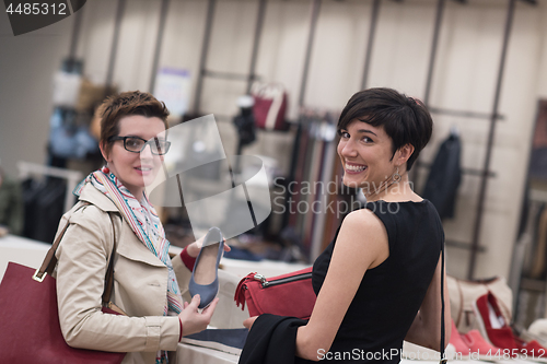 Image of best friend shopping in big mall