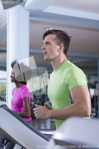 Image of people exercisinng a cardio on treadmill in gym