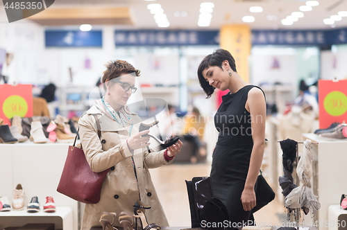 Image of best friend shopping in big mall