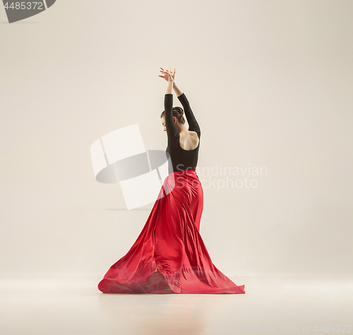 Image of Modern ballet dancer dancing in full body on white studio background.
