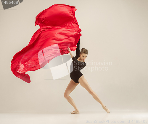 Image of Modern ballet dancer dancing in full body on white studio background.