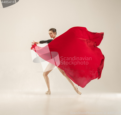 Image of Modern ballet dancer dancing in full body on white studio background.