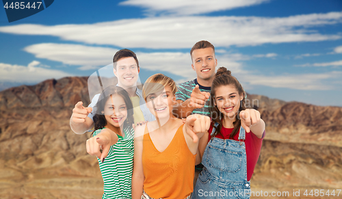 Image of friends pointing at you over grand canyon