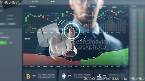 Image of businessman with cryptocurrency on virtual screen