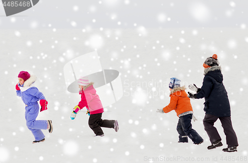 Image of happy little kids playing outdoors in winter