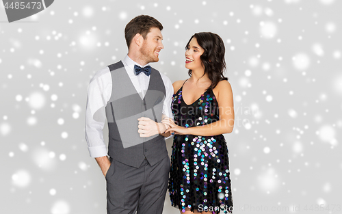 Image of happy couple in festive clothes talking
