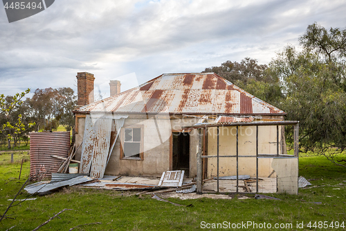 Image of Old abandoned farm house tumbling into ruin