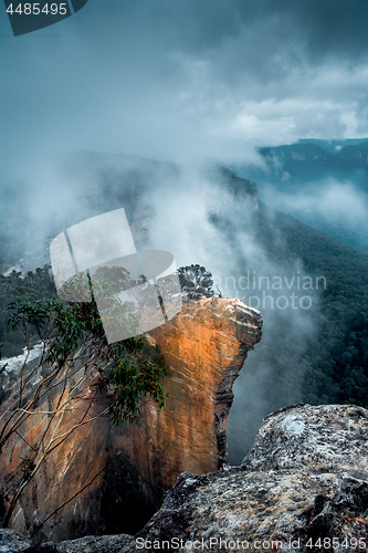 Image of Arise. Fog and mist lifting out of the shrouded dark valleys Hanging Rock