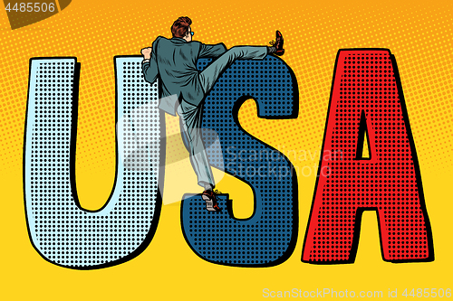 Image of businessman man climbs across the border. usa word letters