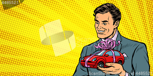 Image of Businessman gives a gift, selling cars