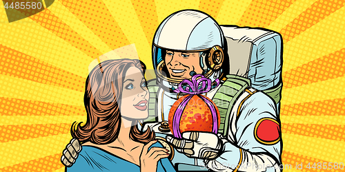 Image of Couple in love. Astronaut gives a woman Mars