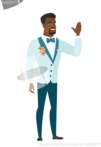Image of Young african-american groom waving his hand.