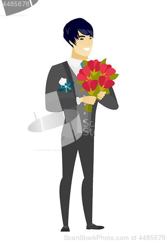 Image of Asian groom holding a bouquet of flowers