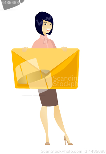 Image of Smiling business woman holding a big envelope.
