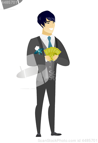 Image of Happy asian groom holding money.