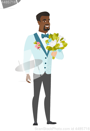 Image of Young caucasian groom with a bridal bouquet.