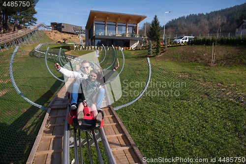 Image of couple enjoys driving on alpine coaster