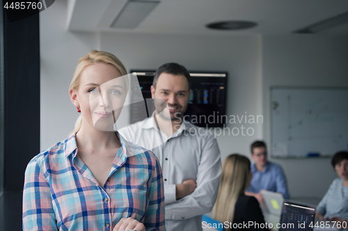 Image of Business People Working With Tablet in startup office