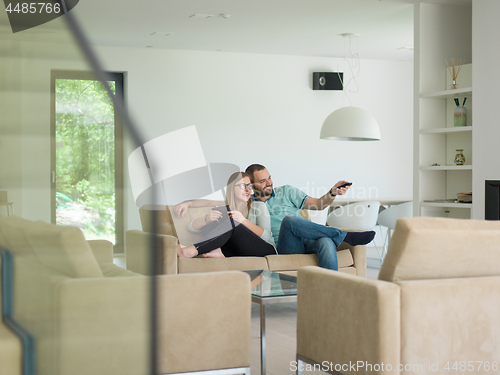 Image of couple relaxes in the living room