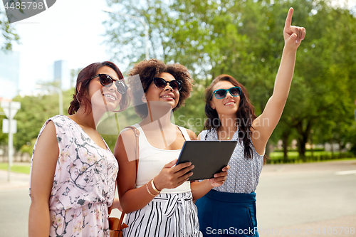 Image of women with tablet pc on street in summer