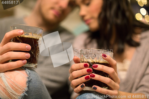 Image of close up of happy couple drinking coffee at home