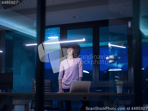 Image of black businesswoman using a laptop in startup office