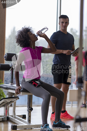 Image of couple in a gym have break