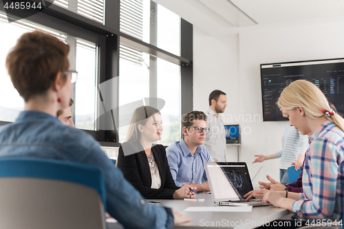 Image of Business Team At A Meeting at modern office building