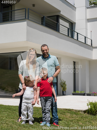 Image of happy family with children in the yard