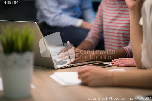 Image of Multiethnic startup business team in night office