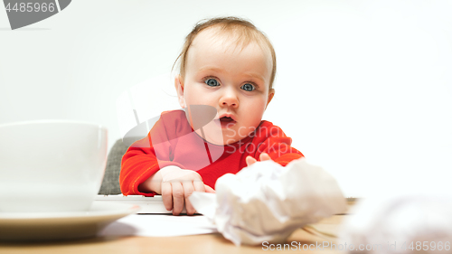 Image of Happy child baby girl toddler sitting with keyboard of computer isolated on a white background