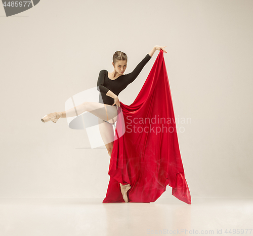 Image of Modern ballet dancer dancing in full body on white studio background.