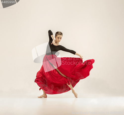 Image of Modern ballet dancer dancing in full body on white studio background.