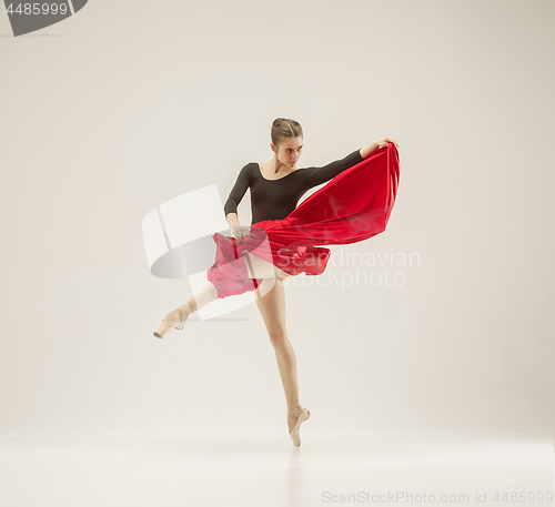 Image of Modern ballet dancer dancing in full body on white studio background.