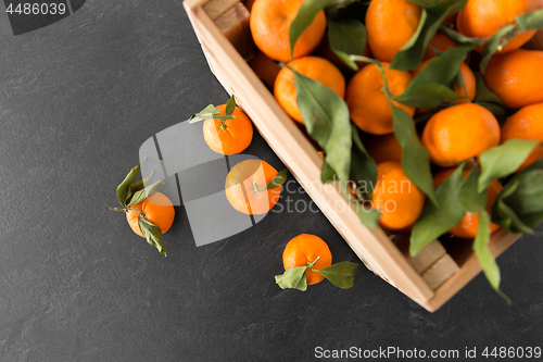 Image of close up of mandarins on slate table top