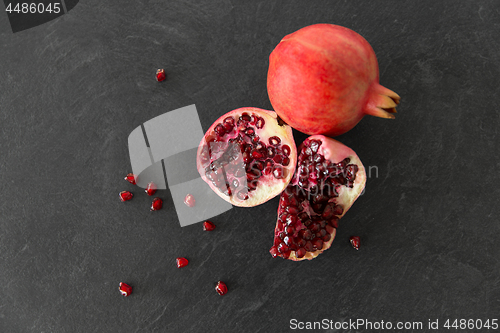 Image of close up of pomegranate on stone table