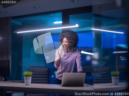 Image of black businesswoman using a laptop in startup office