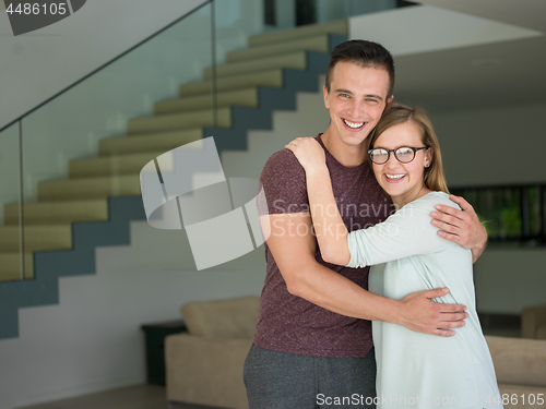 Image of couple hugging in their new home