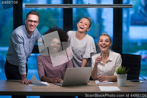 Image of Multiethnic startup business team in night office