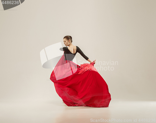 Image of Modern ballet dancer dancing in full body on white studio background.