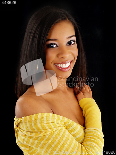 Image of Young smiling black woman portrait against dark background