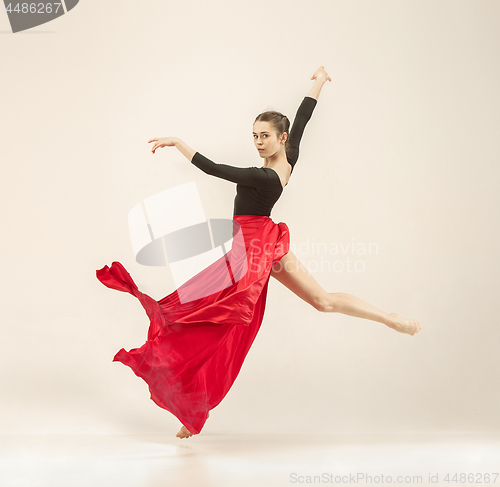 Image of Modern ballet dancer dancing in full body on white studio background.