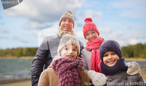 Image of happy family over autumn beach background