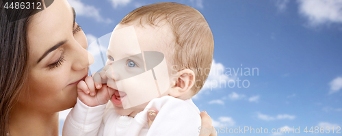 Image of mother with baby over sky background