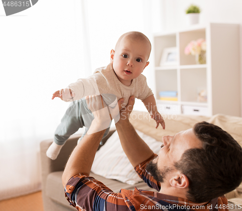 Image of happy little baby boy with father