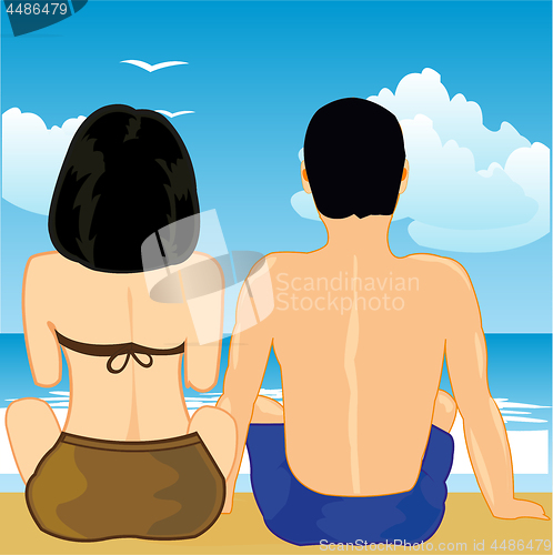 Image of Man and woman sit on song on beach