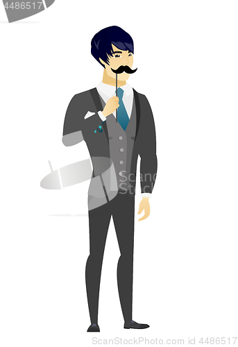 Image of Cheerful groom with a fake mustache.