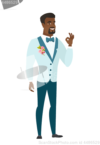 Image of Smiling groom showing ok sign.