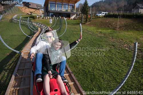 Image of couple enjoys driving on alpine coaster