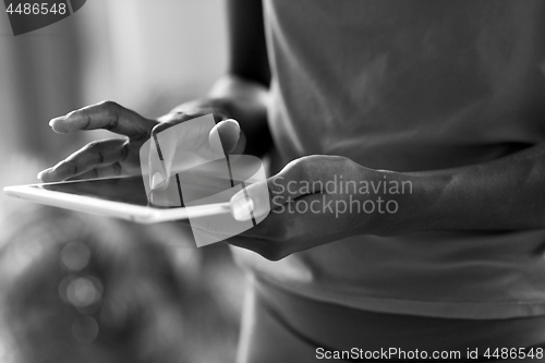 Image of african american woman using tablet